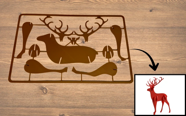 3D-gedrucktes Steckpuzzle eines Elchs aus braunem PLA mit fertigem roten Modell als Beispiel